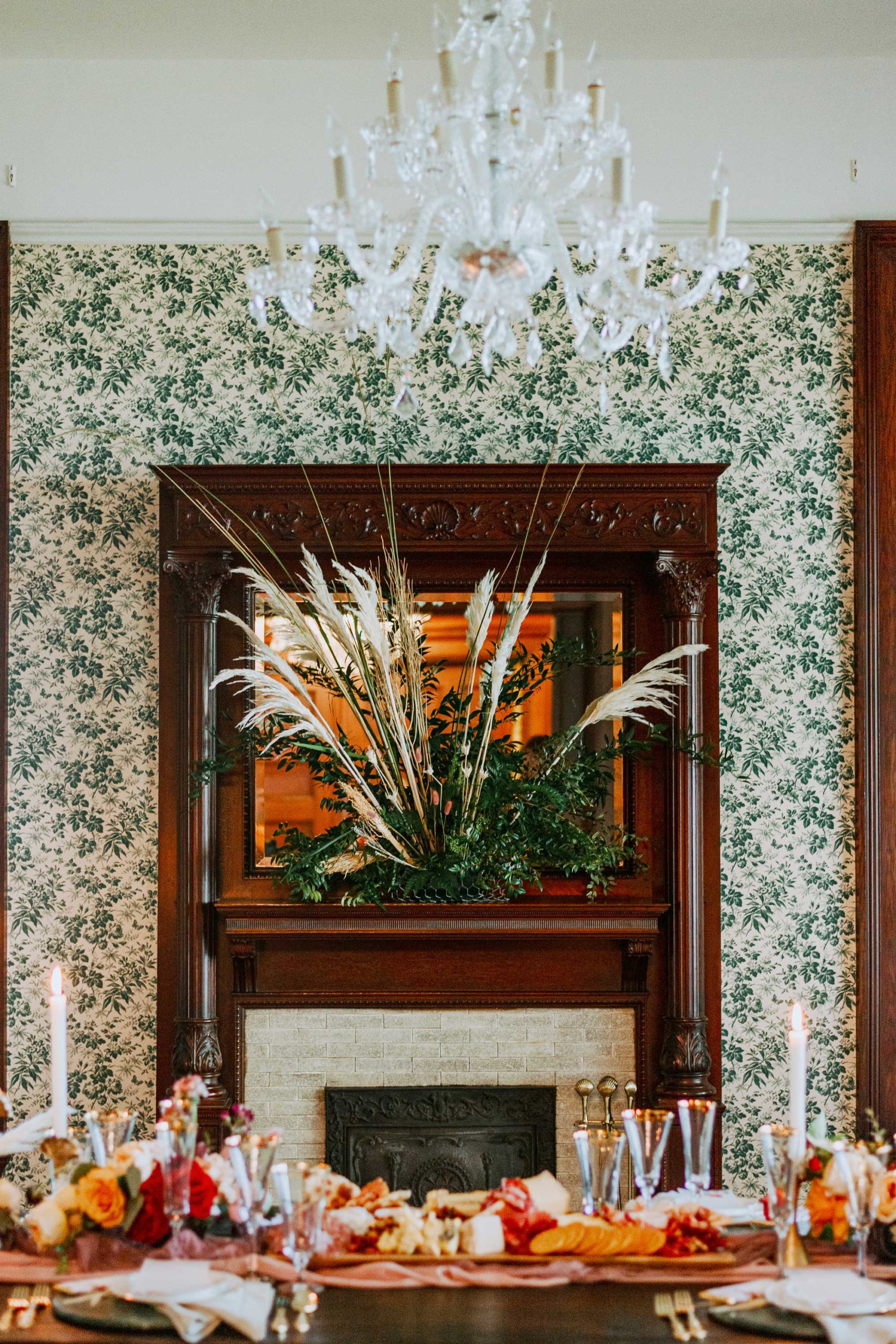 Decorated table and fireplace with crystal chandelier