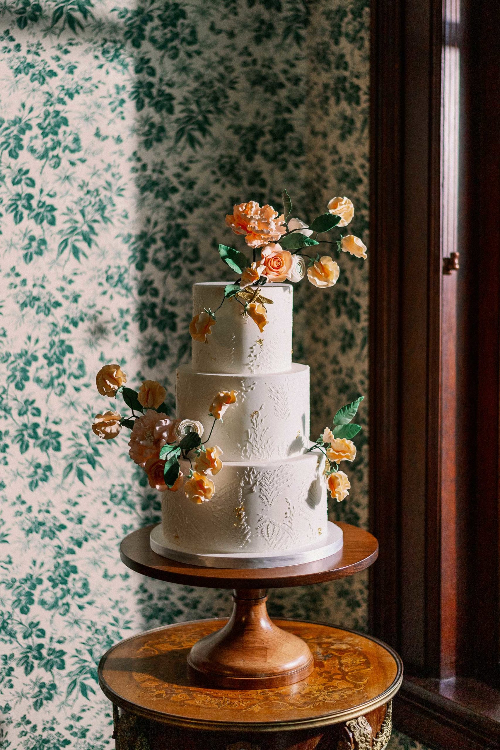 white wedding cake with flowers